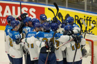 Kazakhstan players celebrate at the end of the preliminary round match between France and Kazakhstan at the Ice Hockey World Championships in Ostrava, Czech Republic, Saturday, May 11, 2024. (AP Photo/Darko Vojinovic)