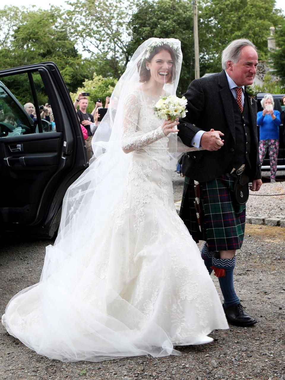 Rose Leslie with her father Sebastian Leslie arrive at Rayne Church, Kirkton of Rayne in Aberdeenshire (Jane Barlow/PA)