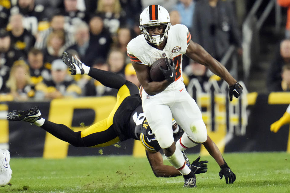 Cleveland Browns running back Nick Chubb runs past Pittsburgh Steelers safety Minkah Fitzpatrick during the first half of an NFL football game Monday, Sept. 18, 2023, in Pittsburgh. (AP Photo/Gene J. Puskar)