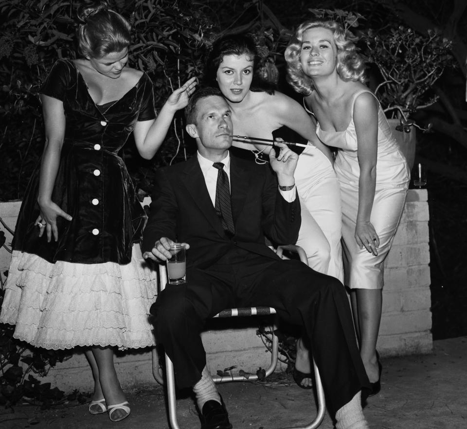 Hugh Hefner with Sylvia Sidney, Joan Bradshaw and Caroline Mitchell at a Playboy&nbsp; party in Los Angeles on June 26, 1957. (Photo: Michael Ochs Archives via Getty Images)