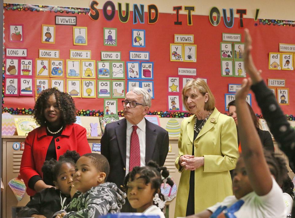Akron Public Schools interim Superintendent Mary Outley, Gov. Mike DeWine and First Lady Fran DeWine, observe a second grade class during a reading lesson Tuesday at Helen Arnold CLC in Akron.