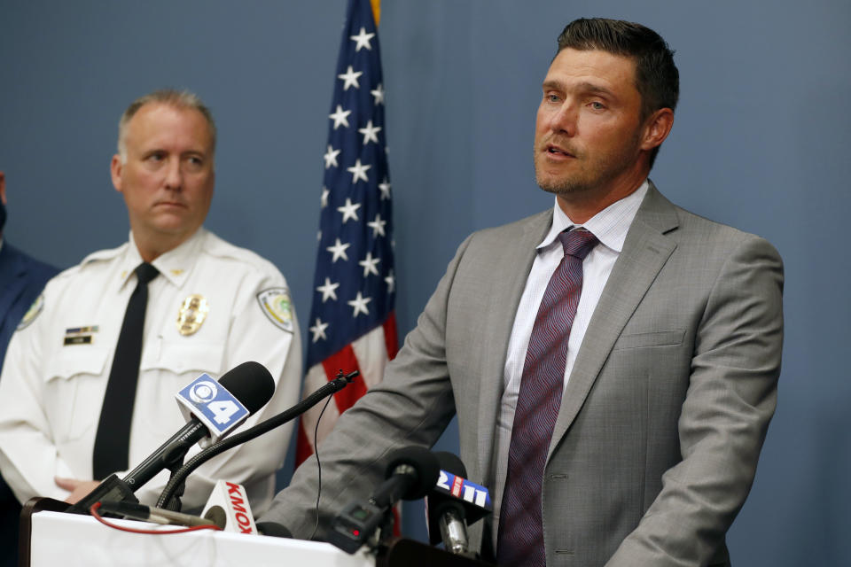 St. Charles County Prosecuting Attorney Tim Lohmar, right, speaks alongside Florissant Police Chief Timothy Fagan during a news conference Wednesday, June 17, 2020, in O'Fallon, Mo. Lohmar, who is acting as special prosecutor in the case against former Florissant Detective Joshua Smith, announced Smith has been charged with two counts of assault and armed criminal action after the now fired detective was apparently captured on video hitting a suspect with a police SUV then kicking and punching the man. (AP Photo/Jeff Roberson)