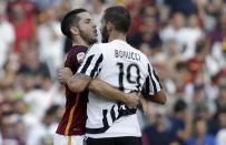 AS Roma's Konstantinos Manolas (L) reacts against Juventus' Leonardo Bonucci during their Serie A soccer match at Olympic stadium in Rome, Italy, August 30, 2015. REUTERS/Max Rossi