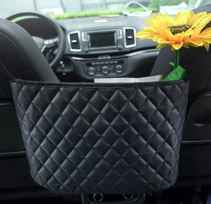 If the passenger seat is occupied, chuck your purse in this pouch