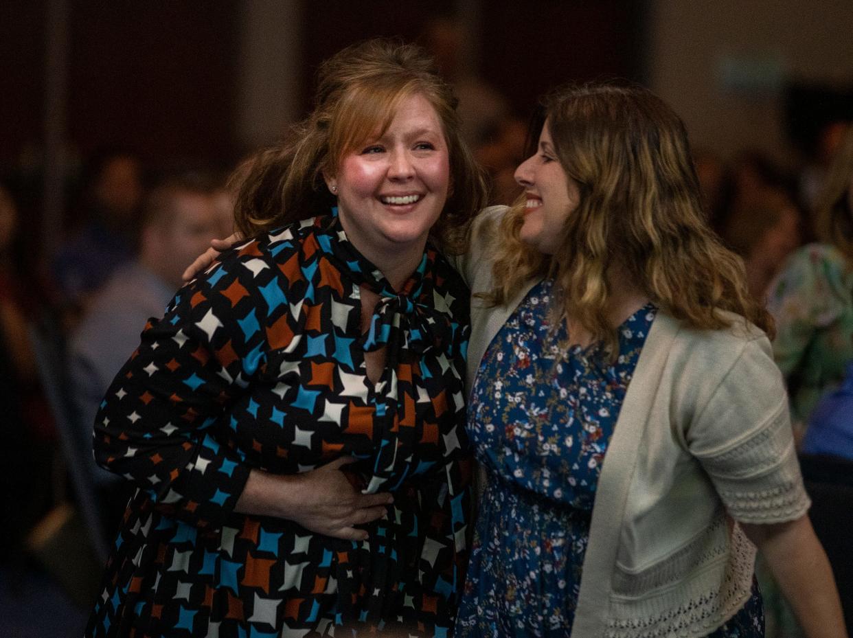 Padgett Elementary teacher Elizabeth Ashmore, left, reacts after being named 2023-2024 Teacher of The Year during the Polk County Public Schools Inspire Awards ceremony at the RP Funding Center in Lakeland on Thursday.