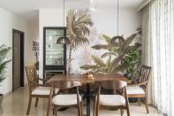 The dining area is the showstopper with its botanical wallpaper that breathes life into the tropical theme of the home.