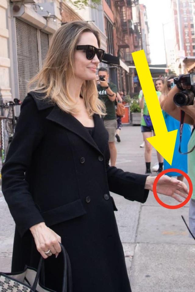 Angelina Jolie debuts middle finger tattoos with mystery message – NBC  Boston