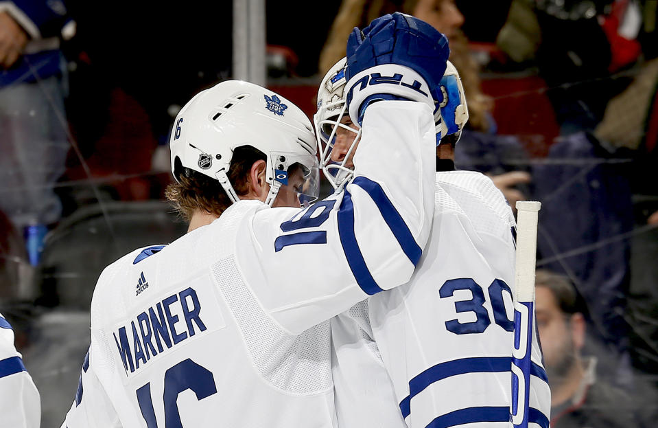 NEWARK, NJ - DECEMBER 27: Winning goaltender Michael Hutchinson #30 and Mitchell Marner #16 of the Toronto Maple Leafs react after defeating the New Jersey Devils in overtime at the Prudential Center on December 27, 2019 in Newark, New Jersey. The Leafs defeated the Devils 5-4. (Photo by Andy Marlin/NHLI via Getty Images)