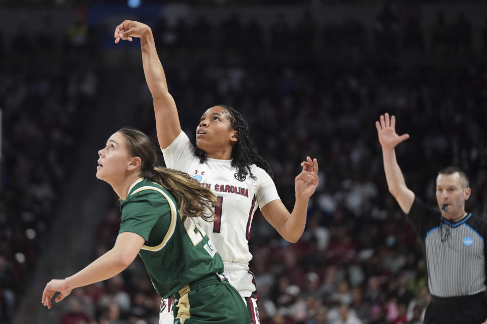 South Carolina guard Zia Cooke (1) follows through on a 3-point basket against South Florida guard Aerial Wilson (22) during the first half in a second-round college basketball game in the NCAA Tournament, Sunday, March 19, 2023, in Columbia, S.C. (AP Photo/Sean Rayford)