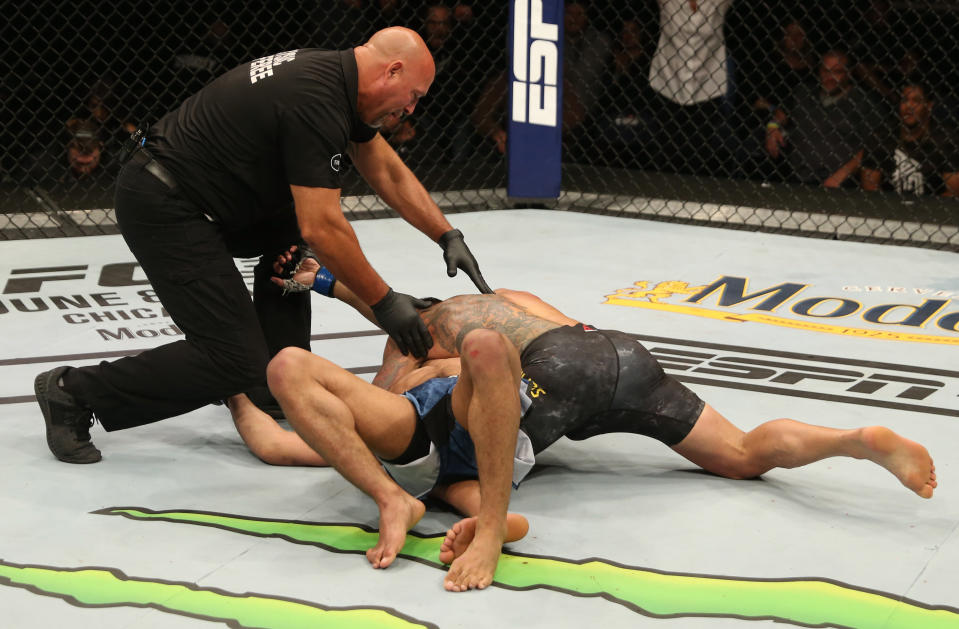 ROCHESTER, NY - MAY 18:  (R-L) Rafael Dos Anjos of Brazil secures an arm triangle choke against Kevin Lee in their welterweight bout during the UFC Fight Night event at Blue Cross Arena on May 18, 2019 in Rochester, New York. (Photo by Michael Owens/Zuffa LLC/Zuffa LLC via Getty Images)