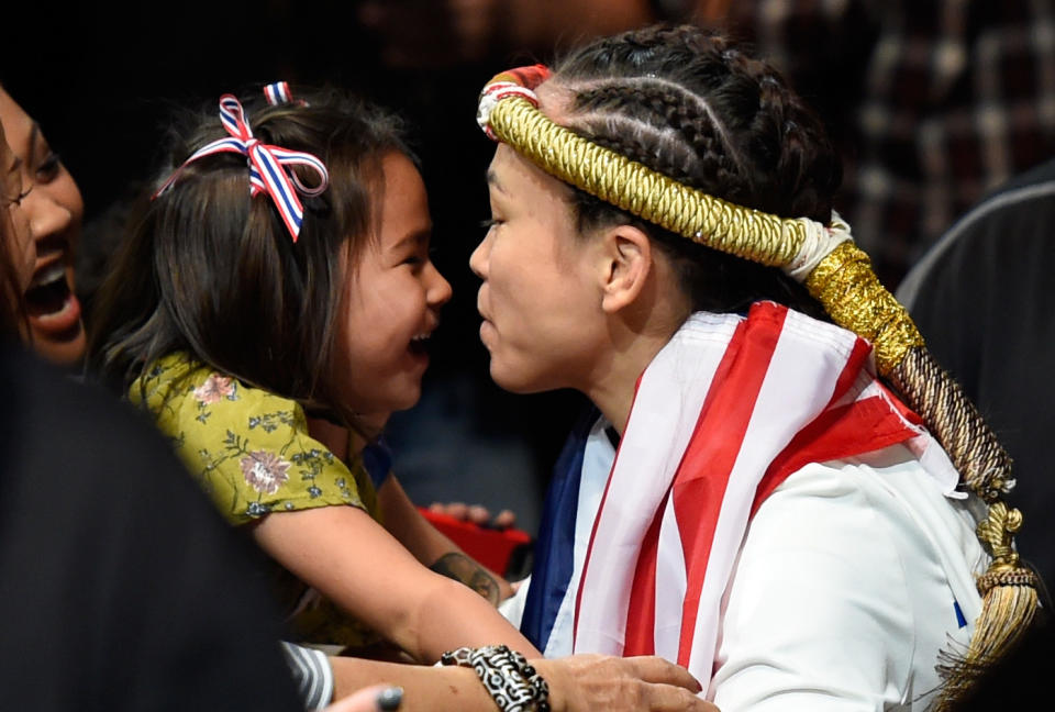 KANSAS CITY, MO - APRIL 15:  Michelle Waterson kisses her daughter Araya Waterson before entering the Octagon during the UFC Fight Night event at Sprint Center on April 15, 2017 in Kansas City, Missouri. (Photo by Josh Hedges/Zuffa LLC/Zuffa LLC via Getty Images)