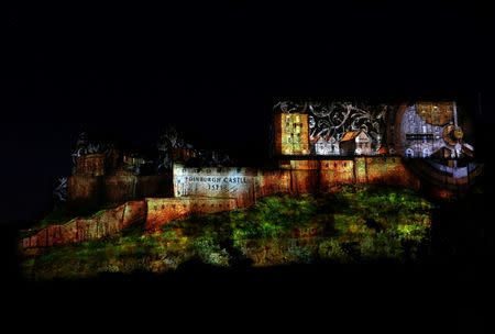 A digital light show called "Deep Time" is beamed onto Edinburgh Castle to mark the start of the Edinburgh Fringe Festival in Edinburgh, Scotland, Britain August 7, 2016. REUTERS/Scott Heppell FOR EDITORIAL USE ONLY. NO RESALES. NO ARCHIVES.