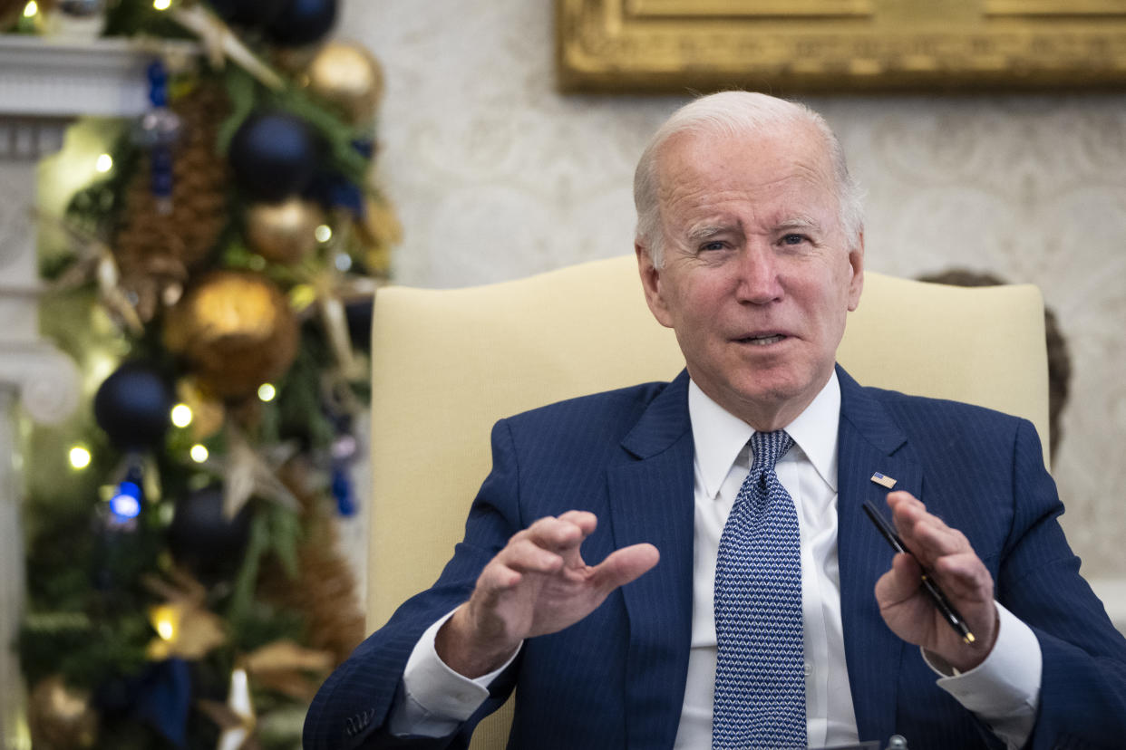 President Biden gestures during a briefing about the recent tornadoes in the Midwest in the Oval Office of the White House.