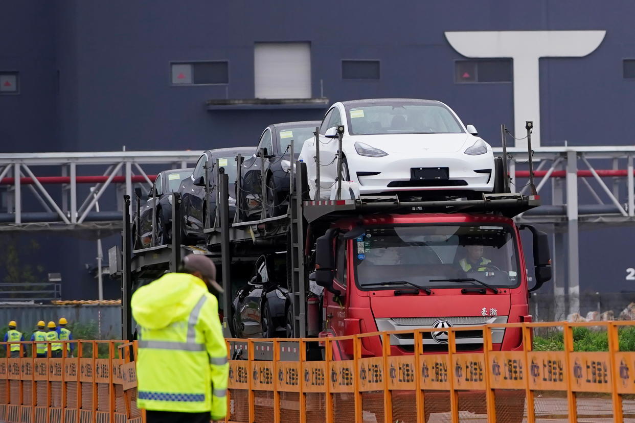 A truck transports new Tesla cars at its factory in Shanghai, China, May 13, 2021. REUTERS/Aly Song