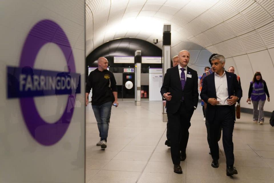 Mr Khan and Mr Byford walk through Farringdon Station after disembarking (Kirsty O’Connor/PA) (PA Wire)