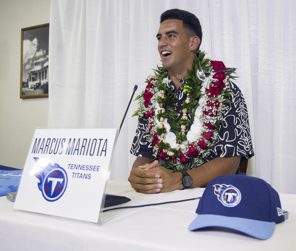FILE - Former Oregon quarterback Marcus Mariota meets with the media after being selected in the first round with the second pick by the Tennessee Titans on NFL Draft Day Thursday, April 30, 2015, in Honolulu. Marcus Mariota is ready to play quarterback for the Washington Commanders if called upon and also serve as a mentor if they draft their QB of the future. (AP Photo/Eugene Tanner, File)