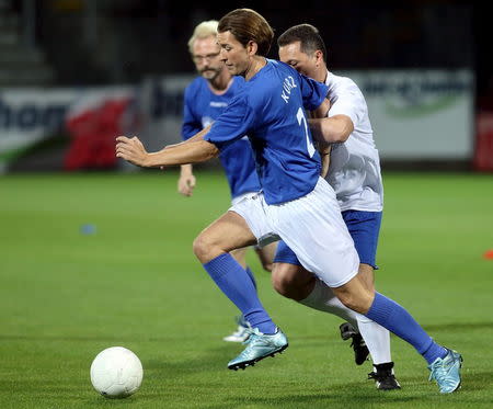 Austria's Foreign Minister Sebastian Kurz (L) and Macedonia's Prime Minister Nikola Gruevski fight for the ball during a politicians' soccer match ahead of the Western Balkans Summit in Vienna, Austria, August 26, 2015. REUTERS/Heinz-Peter Bader