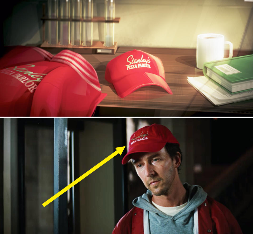 A close-up of a red baseball cap reading, "Stanley's Pizza Parlor"