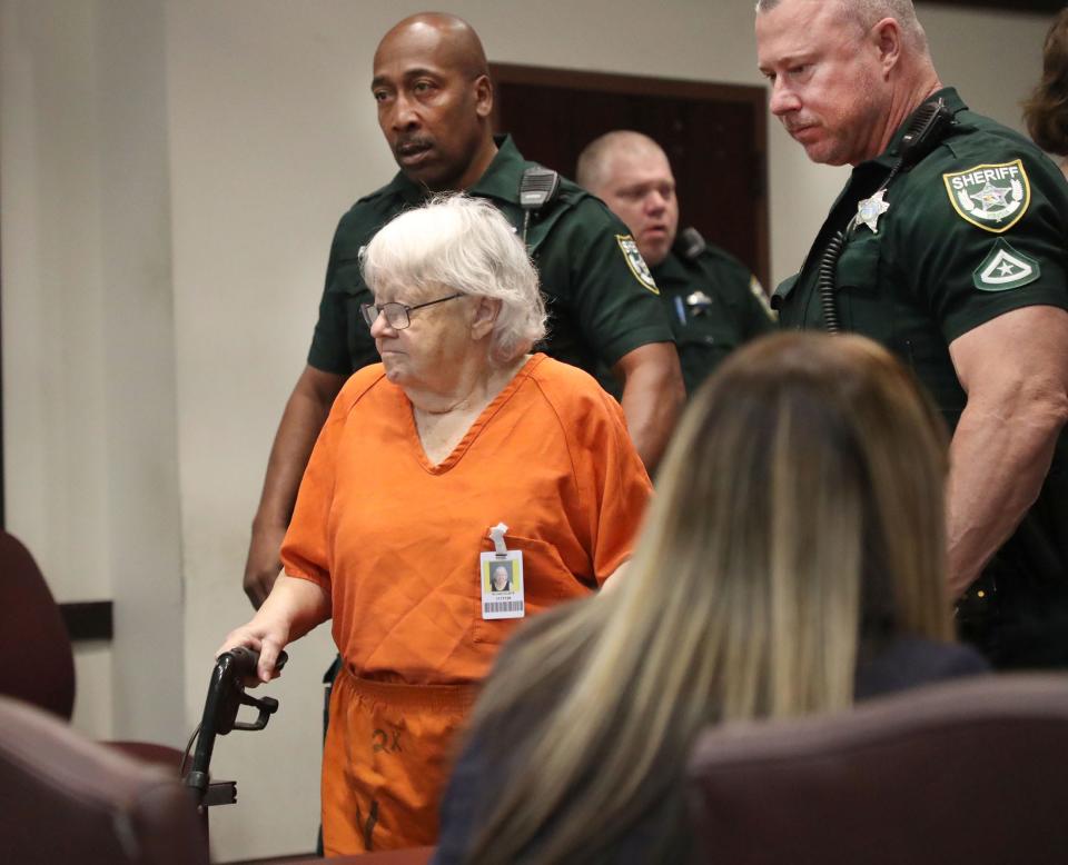 Ellen Gilland, accused of killing her terminally ill husband, is escorted to the defense table, Thursday, March 2, 2023, for a bond hearing before Judge Raul Zambrano at the S. James Foxman Justice Center in Daytona Beach.
