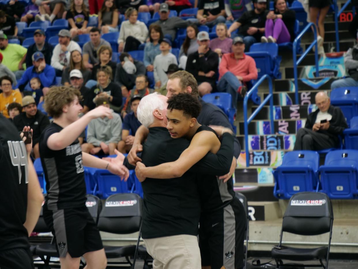 Randall's KJ Thomas (right) embraces head coach Leslie Broadhurst after the Raiders beat Canyon in the 4A Regional Championship game Saturday, March 4, 2023 at Rip Griffin Center in Lubbock.