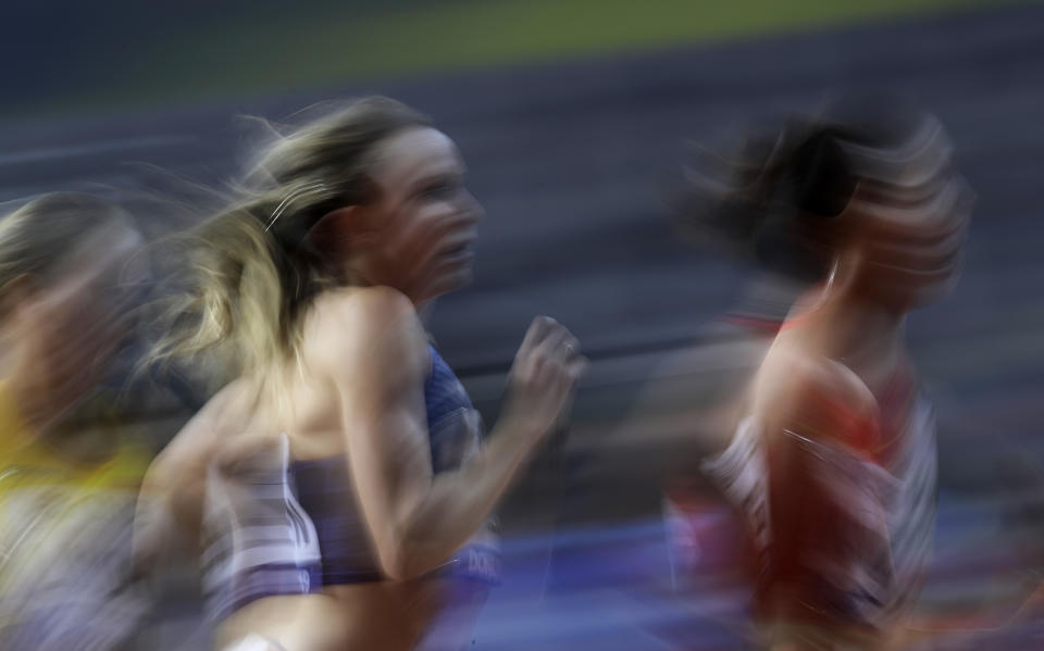 Hanna Green of the United States, left, and China's Wang Chunyu compete during the women's 800 meters heats at the World Athletics Championships in Doha, Qatar, Friday, Sept. 27, 2019. (AP Photo/Petr David Josek)