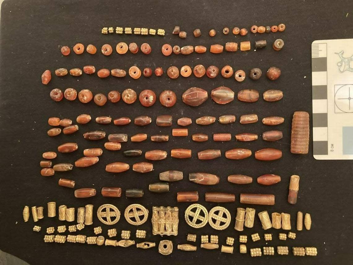 Some of the jewelry beads and gold pendants found in the tomb.