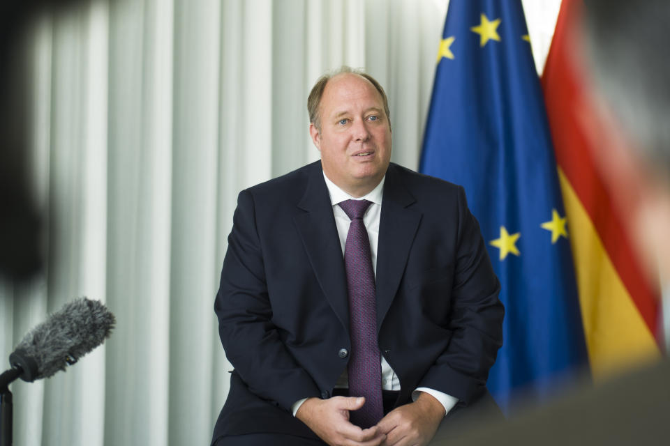 Helge Braun Head of Federal Chancellery and German Minister for Special Task answered questions during an interview with the Associated Press at the chancellery in Berlin, Germany, Tuesday, July 14, 2020. Helge Braun, says Germany has managed to flatten the curve of new coronavirus infections to three per 100,000 inhabitants a week, a very low rate by international comparison, and that the country can avoid a 'second wave' of infections in the fall if citizens keep following rules on social distancing, wearing masks and, if necessary, quarantining in areas that experience spikes in new cases. (AP Photo/Markus Schreiber)