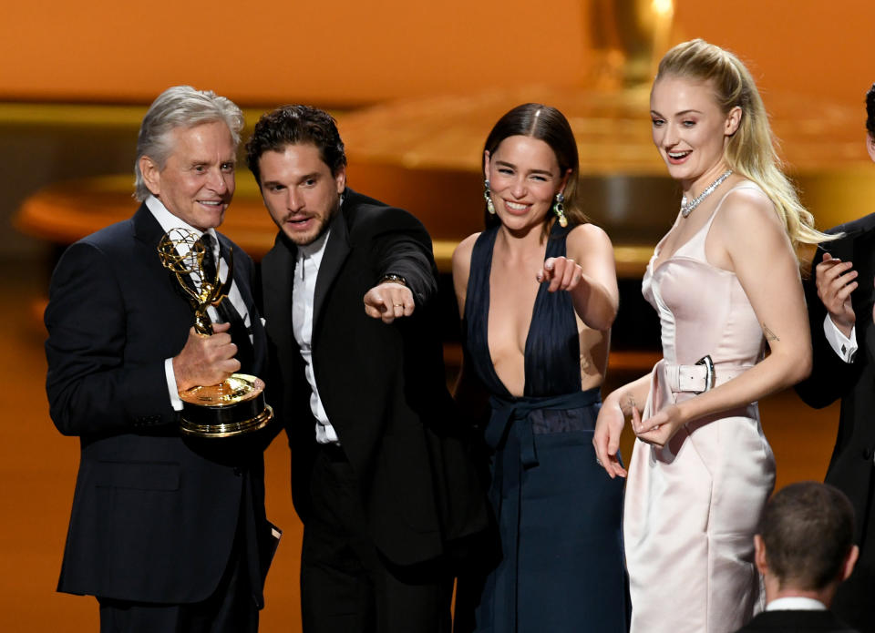 Michael Douglas presents the Outstanding Drama Series award for "Game of Thrones" to Kit Harington, Emilia Clarke and Sophie Turner. (Photo: Getty Images)