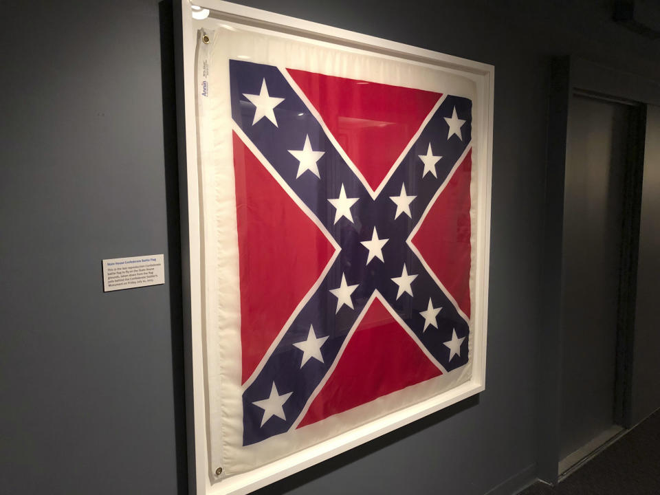 This Dec. 21, 2018, photo provided by the South Carolina Confederate Relic Room shows the final Confederate flag used at the South Carolina Statehouse, on display at the Confederate Relic Room in Columbia, S.C. It took more than three years after the flag was removed on July 10, 2015, to put it on display. (Brad Warthen/South Carolina Confederate Relic Room via AP)