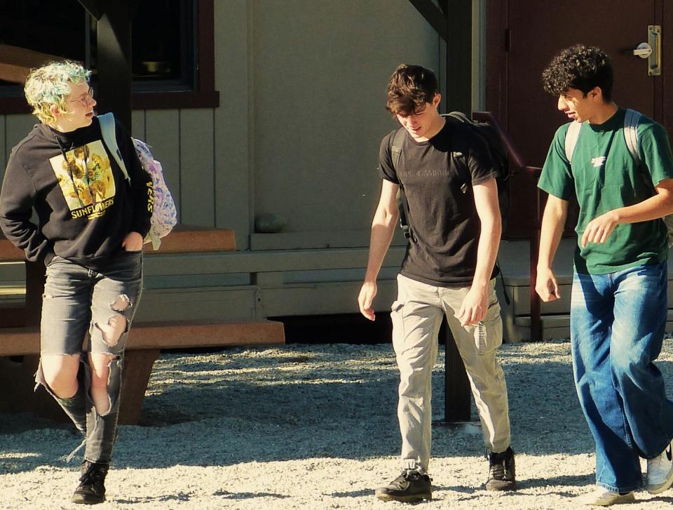 Nick Patterson, 15, from left, Gracen Mayes and Ali Aljamal walk to class at Redding School of the Arts on Wednesday, April 17, 2024. Aljamal is a foreign exchange student from Gaza.