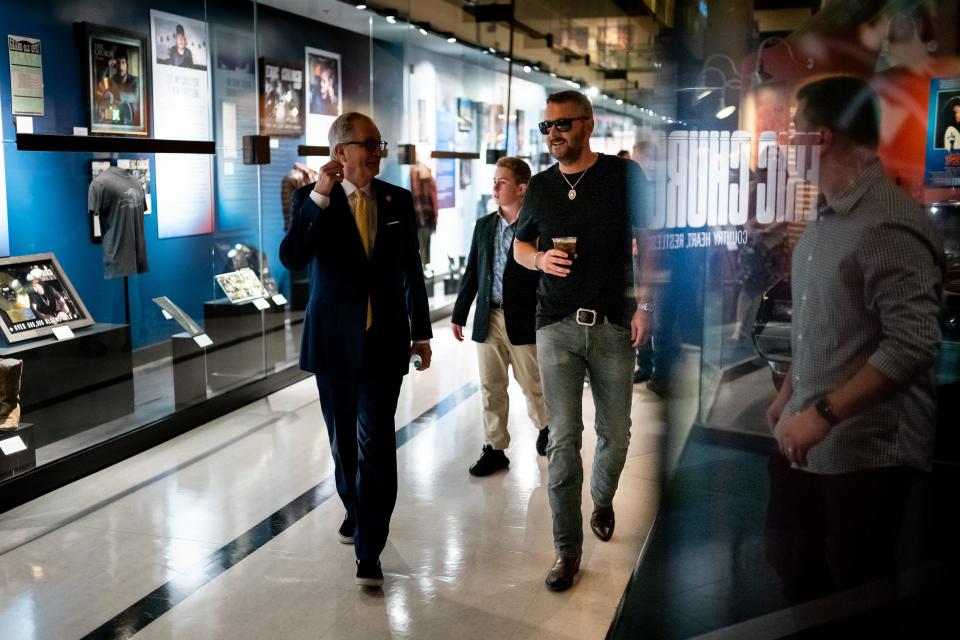 Country Music Hall of Fame CEO Kyle Young, left, leads Eric Church on a tour of the Hall of Fame's new exhibit, "Eric Church: Country Heart, Restless Soul."
