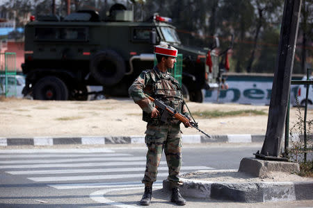 An Indian army soldier stands guard on a road on the outskirts of Srinagar, October 3, 2016. REUTERS/Danish Ismail