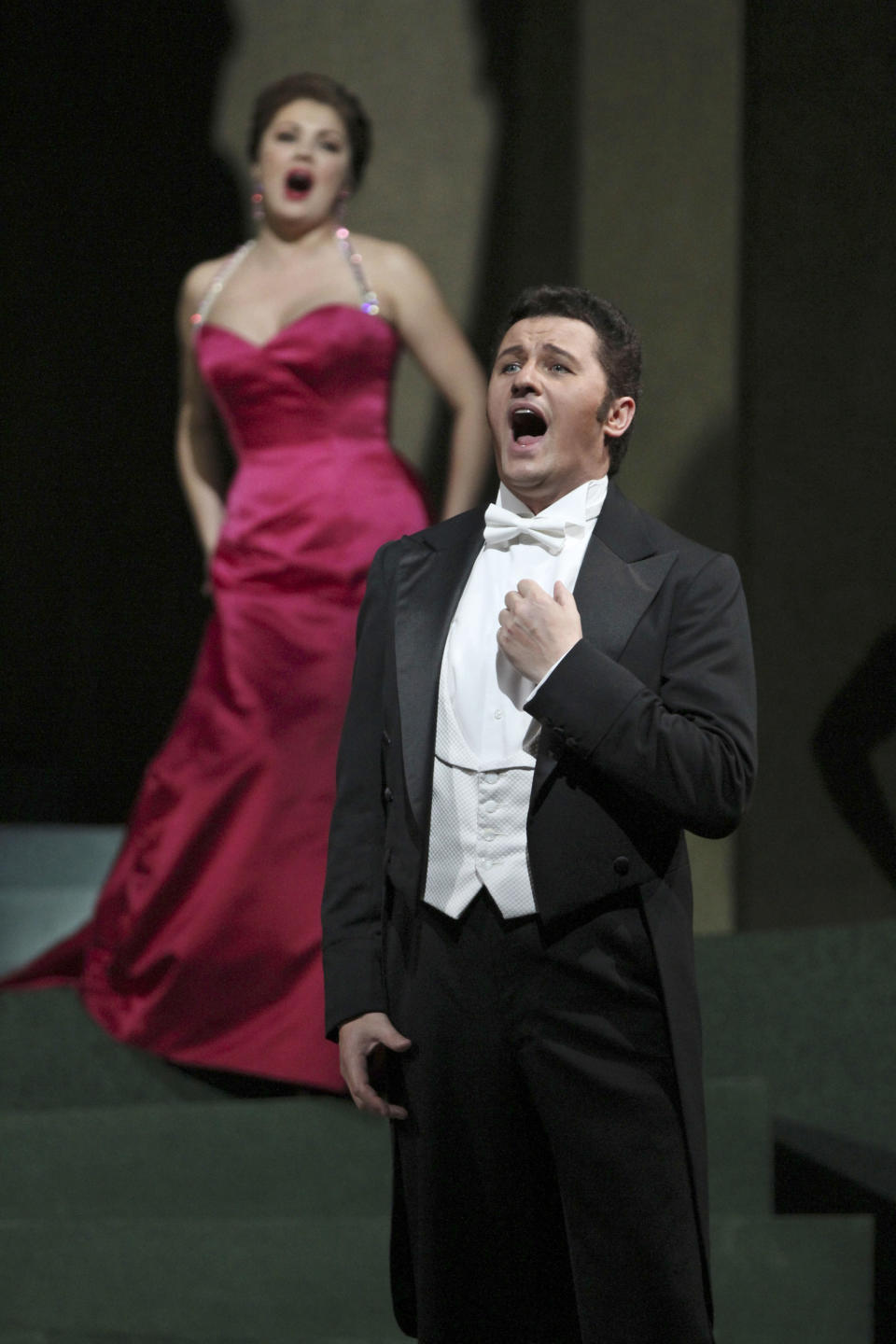 In this Friday, March 23, 2012 photo, Anna Netrebko performs the title role alongside Piotr Beczala as Chevalier des Grieux during the final dress rehearsal of Jules Massenet's "Manon," at the Metropolitan Opera in New York. (AP Photo/Mary Altaffer)