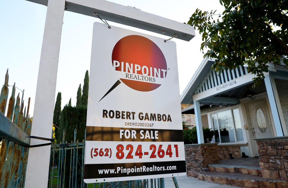 LOS ANGELES, CALIFORNIA - DECEMBER 19: A sign is posted in front of a home that is for sale on December 19, 2022 in Los Angeles, California. The National Association of Realtors will release its November data on existing home sales later this week after October saw existing home sales decline 28 percent from one year earlier. (Photo by Mario Tama/Getty Images)