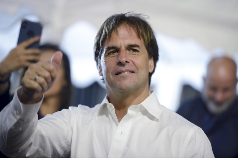 Opposition presidential candidate Luis Lacalle Pou makes a thumb up after a runoff elections in Montevideo, Uruguay, Sunday, Nov. 24, 2019. Uruguayans are choosing between Presidential candidate for the ruling party Broad Front Daniel Martinez and Lacalle. (AP Photo/Santiago Mazzarovich)