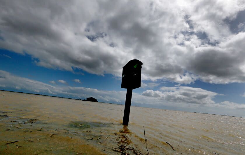 LEMOORE, CALIF. - MAR. 21, 2023. A mailbox stands in the floodwaters that have innundated farms near the community of Stratford. Recent heavy rains and snowmelt from surrounding mountains have swollen the rivers that flow into the vast and fertile San Joaquin Valley. Tulare Lake, a ghost lake that was drained more than 100 years ago, is slowly filling up and more flooding is expected with greater spring snowmelt. (Luis Sinco / Los Angeles Times)