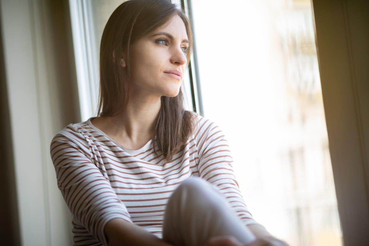 Woman relaxing by the window. 