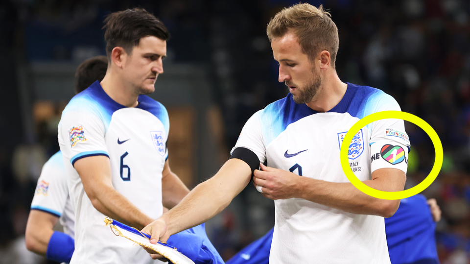 England captain Harry Kane (pictured right) handing over the armband to Harry McGuire (pictured left).