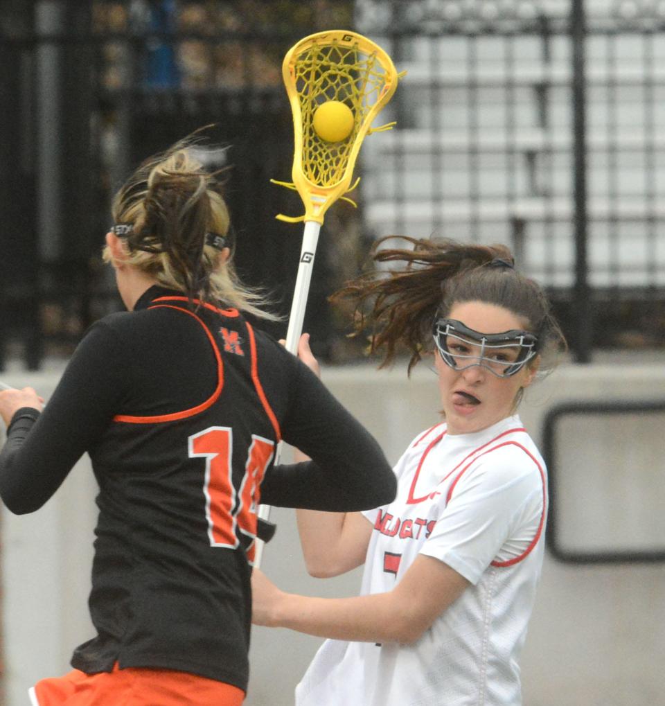 NFA's Molly Page spins away from Montville's Addie Concascia during their game in Norwich.
(Photo: [John Shishmanian/ NorwichBulletin.com])