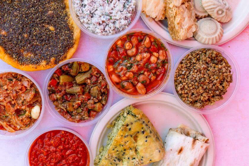 Los Angeles, CA - November 12: A selection of Mediterranean food from Nesrin Al-Diab owner of Mediterranean Pastry Den at the Mar Vista farmers market on Sunday, Nov. 12, 2023 in Los Angeles, CA. (Jason Armond / Los Angeles Times)