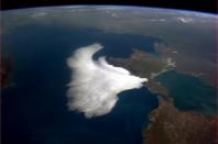 Clouds swoop in on Crimea, a white bird on the Black Sea. <a href="https://twitter.com/Cmdr_Hadfield/" rel="nofollow noopener" target="_blank" data-ylk="slk:(Photo by Chris Hadfield/Twitter);elm:context_link;itc:0;sec:content-canvas" class="link ">(Photo by Chris Hadfield/Twitter)</a>