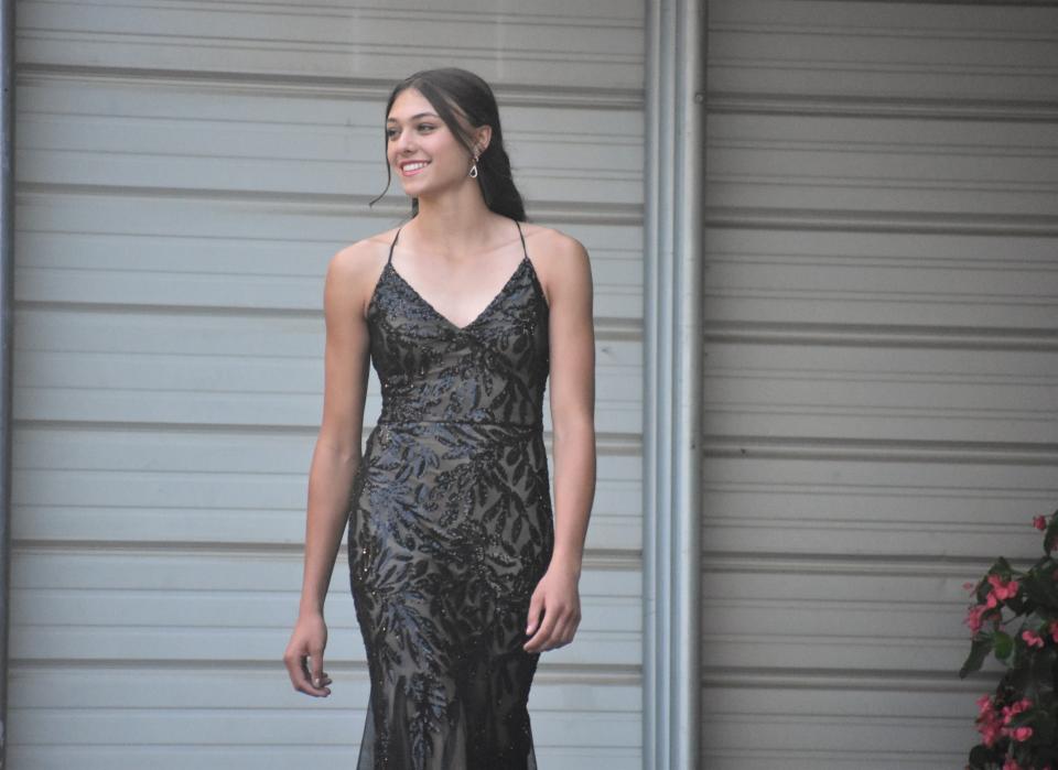 Tanana Emmendorfer, first runner-up in Sunday's Lenawee County Fair queen's contest, participates in the evening gown portion of the competition, which is designed to exhibit elegance and poise.