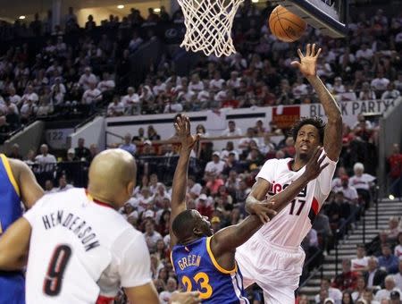 May 9, 2016; Portland, OR, USA; Portland Trail Blazers center Ed Davis (17) shoots over Golden State Warriors forward Draymond Green (23) in game four of the second round of the NBA Playoffs at Moda Center at the Rose Quarter. Mandatory Credit: Jaime Valdez-USA TODAY Sports