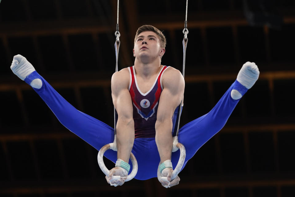 The Russian Olympic Committee's Aleksandr Kartsev performs on the rings during the men's artistic gymnastic qualifications at the 2020 Summer Olympics, Saturday, July 24, 2021, in Tokyo. (AP Photo/Gregory Bull)