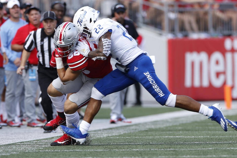 Tulsa defensive back LJ Wallace, right, forces Ohio State tight end Jeremy Ruckert out of bounds during the first half of an NCAA college football game Saturday, Sept. 18, 2021, in Columbus, Ohio. (AP Photo/Jay LaPrete)