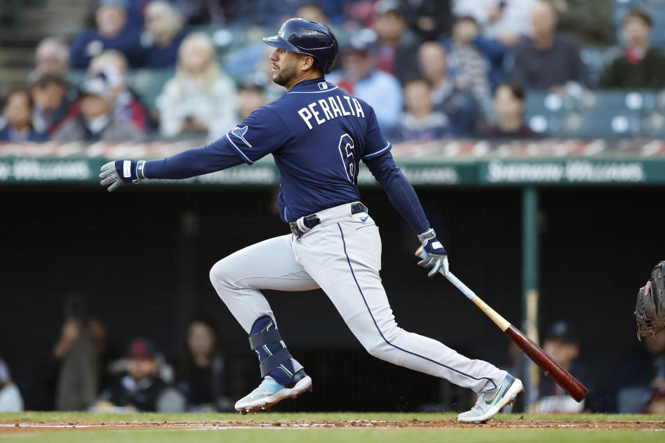 Tampa Bay Rays' David Peralta watches his RBI single off Cleveland Guardians starting pitcher Cal Quantrill during the first inning of a baseball game Thursday, Sept. 29, 2022, in Cleveland. (AP Photo/Ron Schwane)