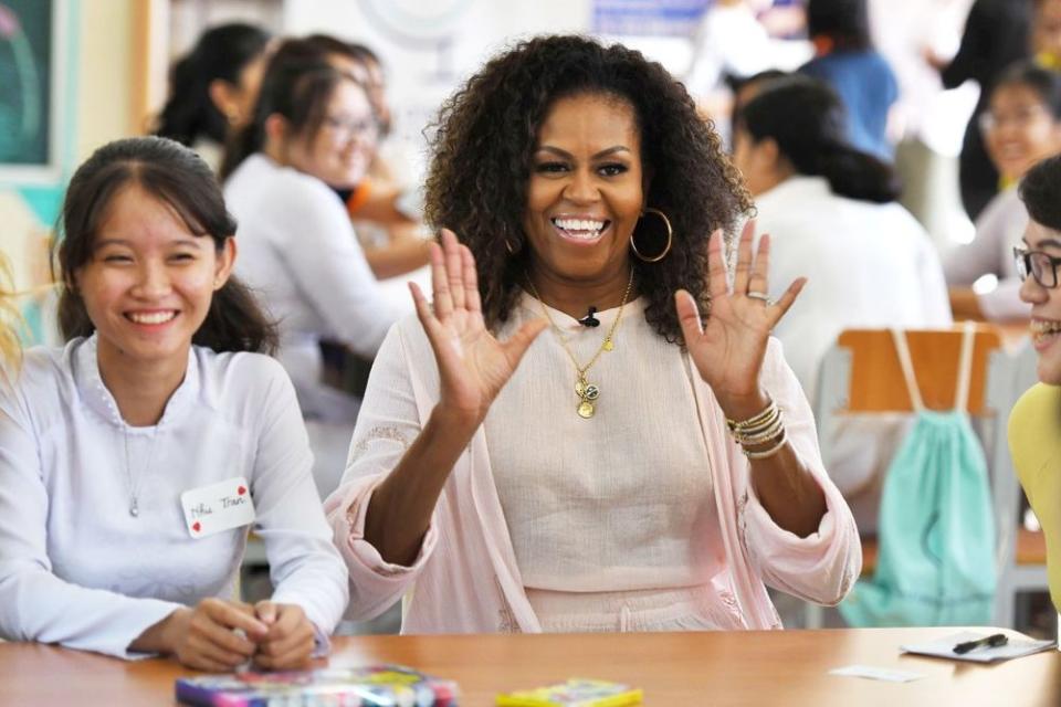 Michelle Obama (center) during her visit with Vietnamese students this week | STR/EPA-EFE/Shutterstock