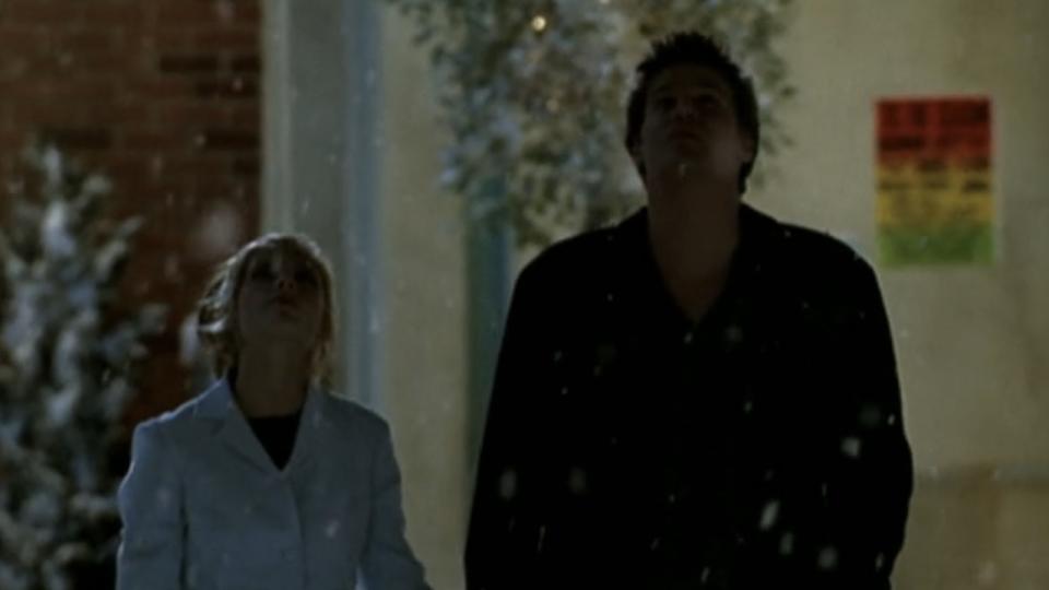 Buffy and Angel looking up at the snow