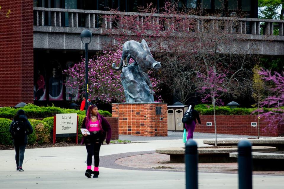 Students walk past Southern Illinois University Edwardsville’s Morris University Center on Thursday, April 6, 2023, at the campus in Edwardsville.