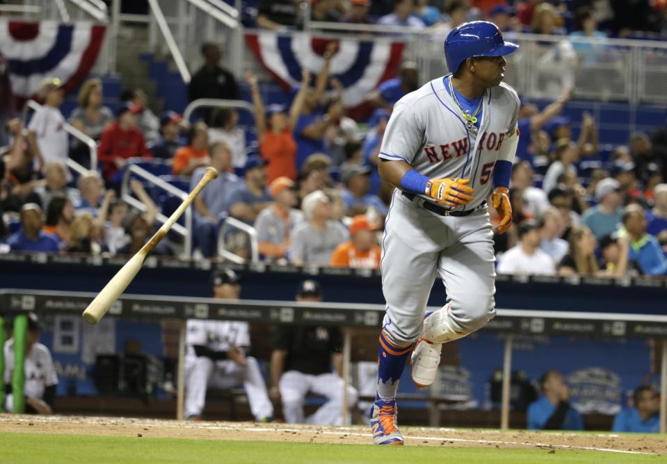 Yoenis Cespedes tosses his bat after hitting a home run during the third inning in Miami. (AP Photo/Lynne Sladky)